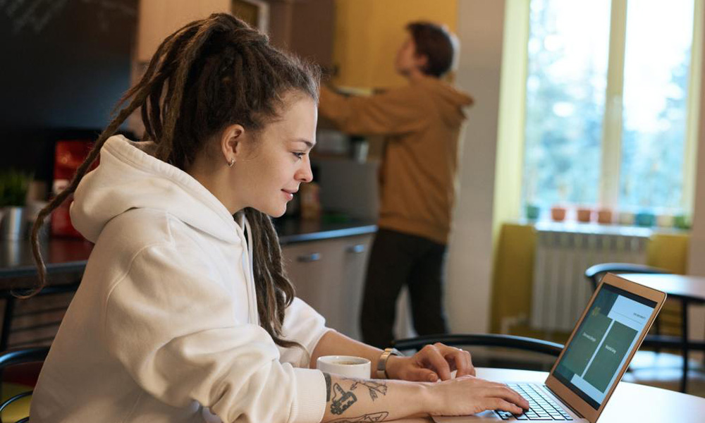 Woman working in a coffee shop on her computer